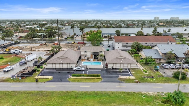 aerial view with a residential view and a water view