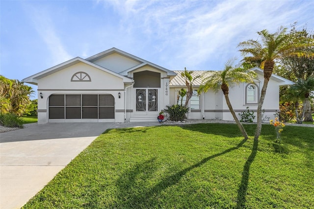 view of front of home featuring a front lawn and a garage