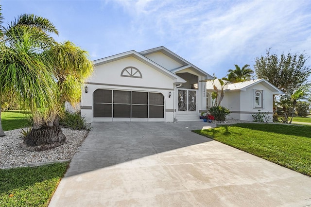 view of front facade featuring a garage and a front yard