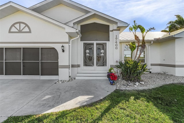 view of exterior entry featuring a garage