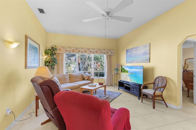 living room with ceiling fan and light tile patterned flooring