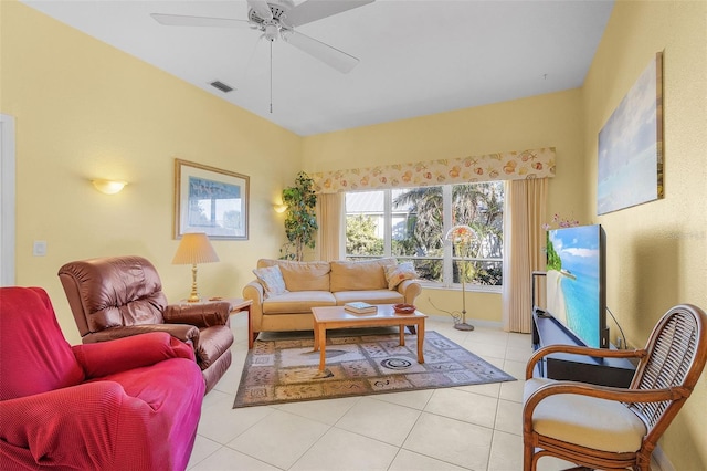 living room featuring ceiling fan and light tile patterned floors