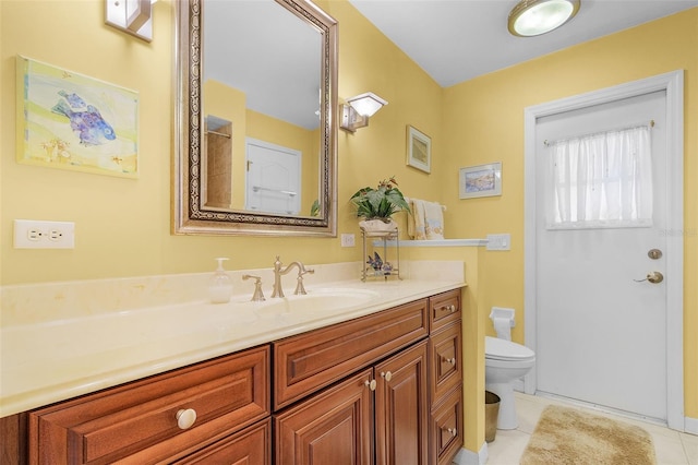 bathroom featuring tile patterned floors, vanity, and toilet