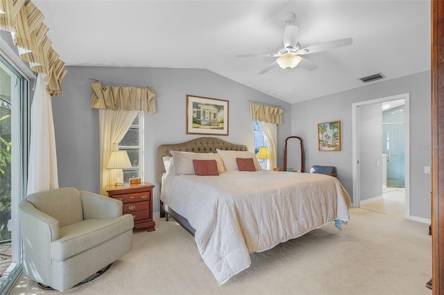 carpeted bedroom with vaulted ceiling and ceiling fan