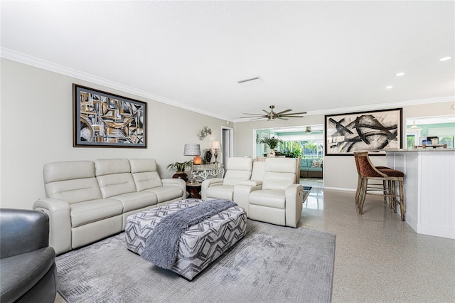 living room featuring crown molding and ceiling fan