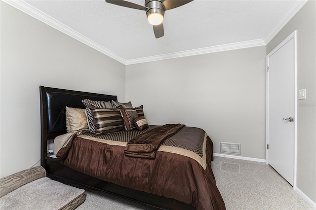 carpeted bedroom with a textured ceiling, ceiling fan, and crown molding