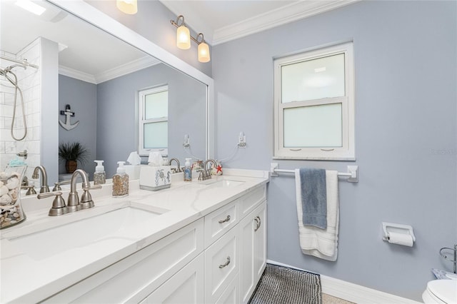 bathroom featuring vanity, toilet, and ornamental molding