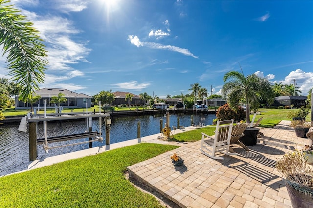 view of patio featuring a boat dock and a water view