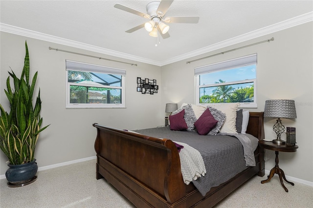 carpeted bedroom featuring ceiling fan and ornamental molding