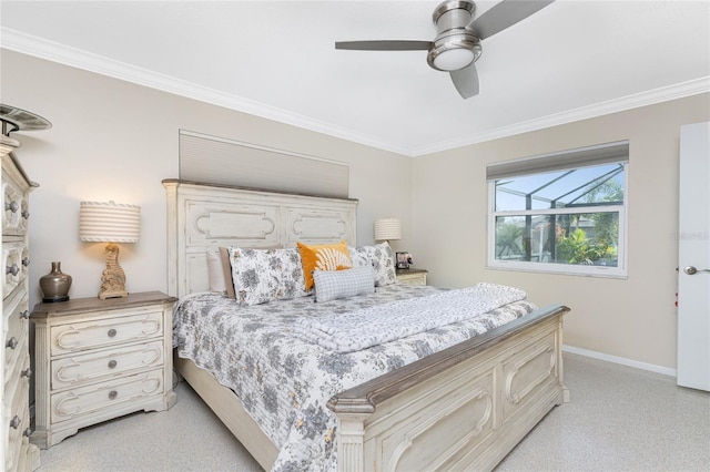 carpeted bedroom with ceiling fan and ornamental molding