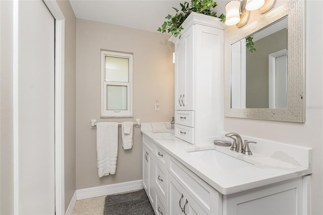 bathroom with vanity and a textured ceiling