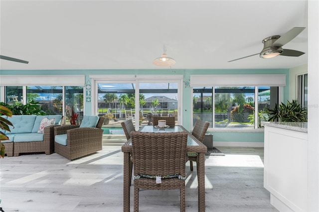 sunroom / solarium with ceiling fan