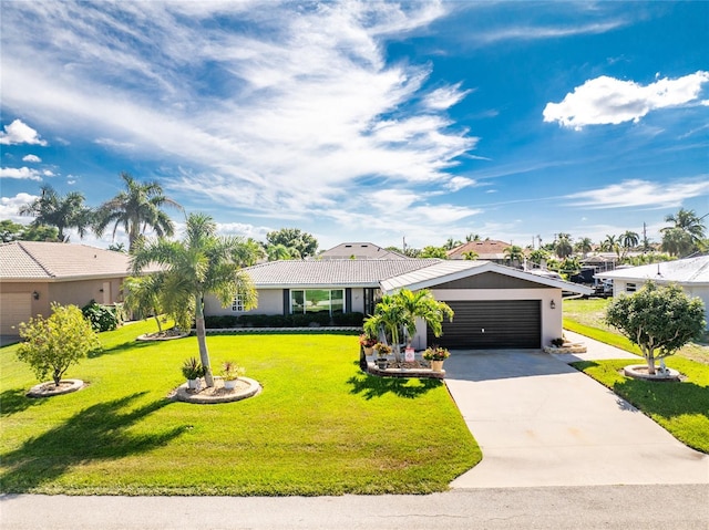 ranch-style home with a front yard and a garage