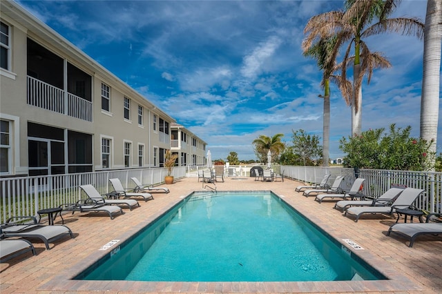 view of swimming pool with a patio