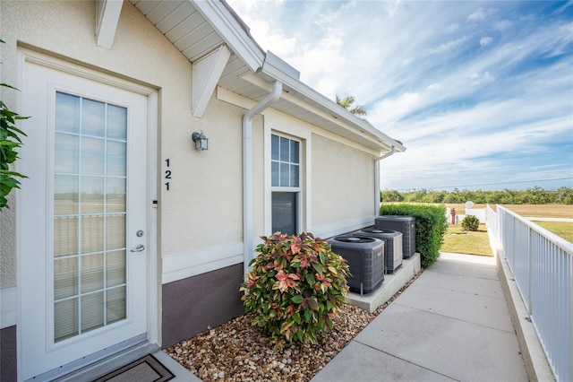 doorway to property featuring central AC