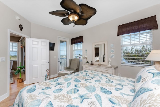 bedroom with ceiling fan and light wood-type flooring