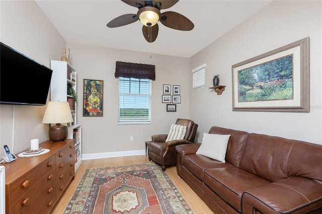 living room featuring hardwood / wood-style flooring and ceiling fan