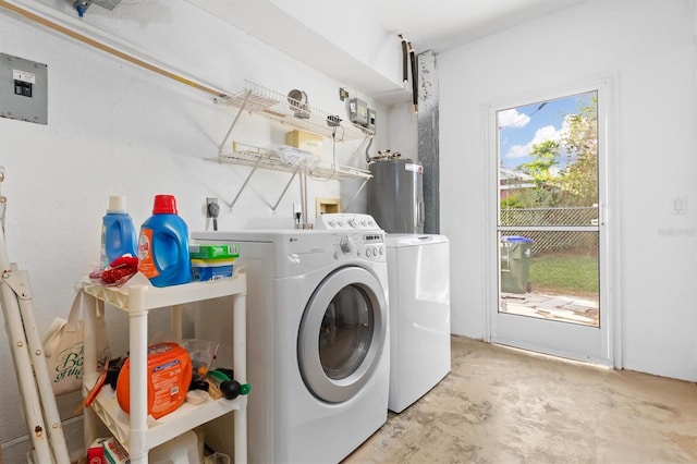 laundry area featuring water heater and washer and dryer