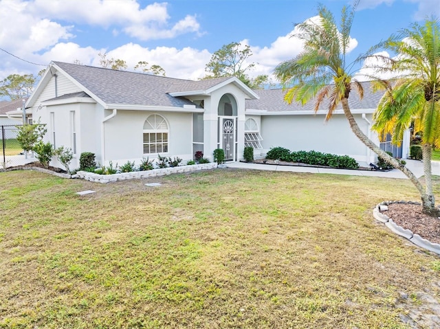 ranch-style house with a front yard