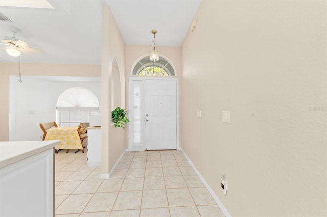 entrance foyer with light tile patterned floors and ceiling fan