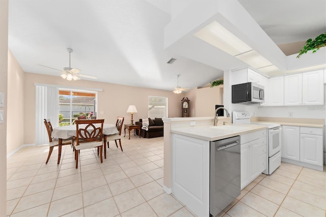 kitchen with ceiling fan, white cabinetry, kitchen peninsula, and appliances with stainless steel finishes