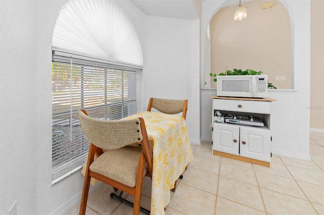 sitting room featuring light tile patterned floors