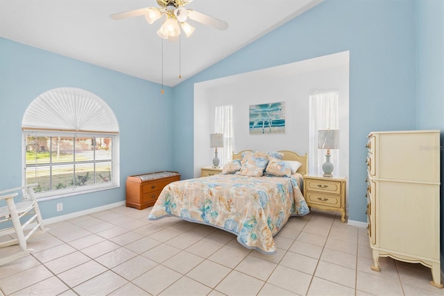 tiled bedroom with ceiling fan and vaulted ceiling