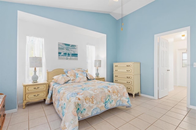 bedroom with light tile patterned floors, ceiling fan, and lofted ceiling