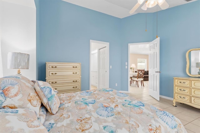 tiled bedroom with ceiling fan