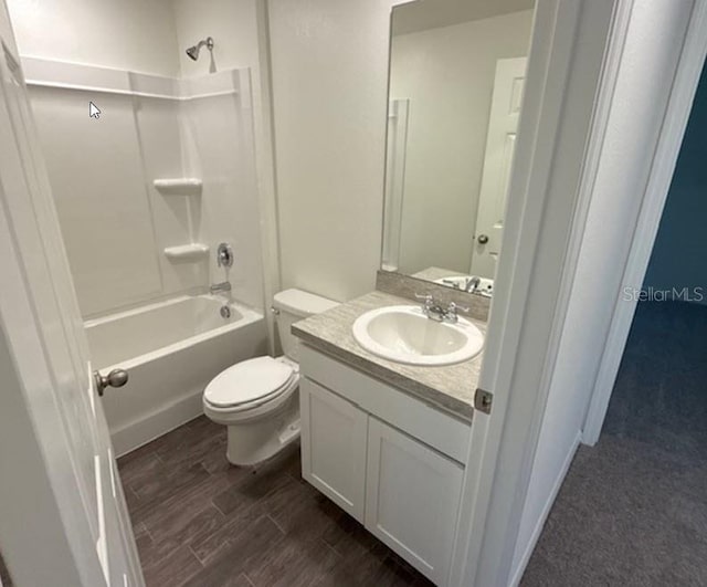 full bathroom with vanity, toilet, wood-type flooring, and bathing tub / shower combination