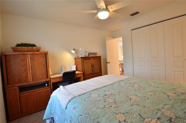 carpeted bedroom with a closet and ceiling fan