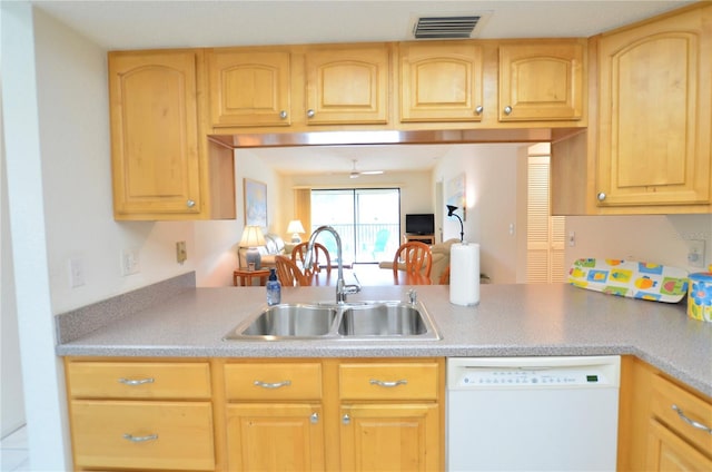 kitchen featuring light brown cabinetry, ceiling fan, sink, and white dishwasher