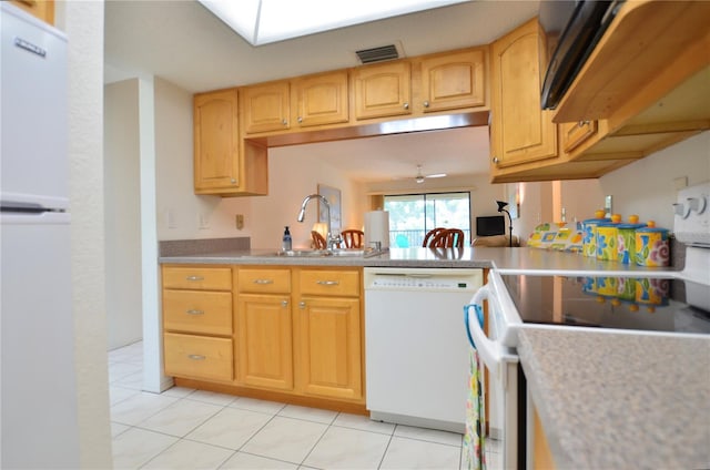 kitchen with ceiling fan, sink, light tile patterned flooring, and white appliances