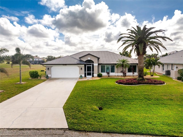 ranch-style home featuring central AC, a front lawn, and a garage