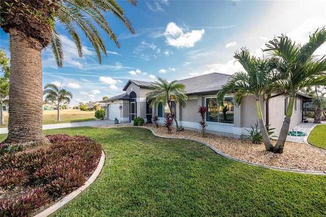 ranch-style house with a garage and a front yard