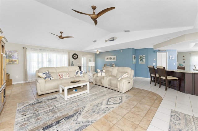 tiled living room with vaulted ceiling and ceiling fan