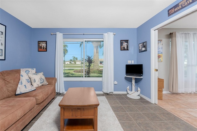 living room with dark tile patterned flooring