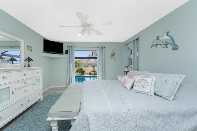 bedroom with access to outside, ceiling fan, and dark hardwood / wood-style flooring