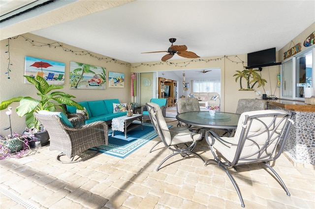 view of patio / terrace with an outdoor living space and ceiling fan