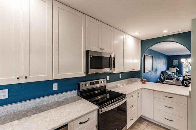 kitchen featuring white cabinets and stainless steel appliances