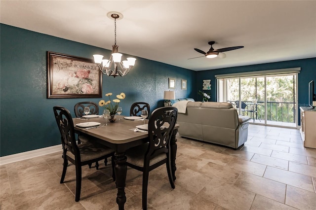 dining space with ceiling fan with notable chandelier