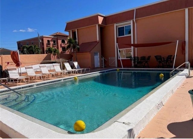 view of pool featuring a patio area