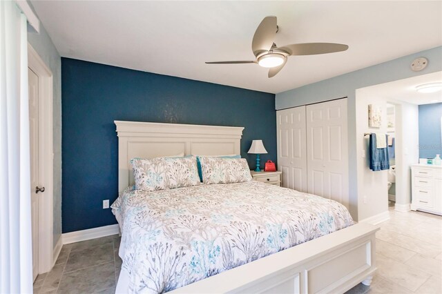 bedroom featuring a closet, ceiling fan, and light tile patterned flooring