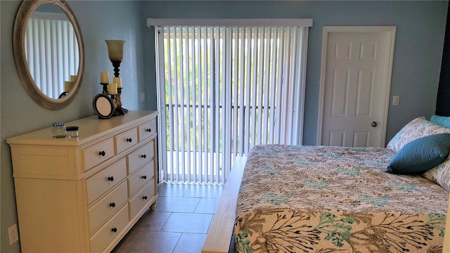 tiled bedroom featuring access to exterior