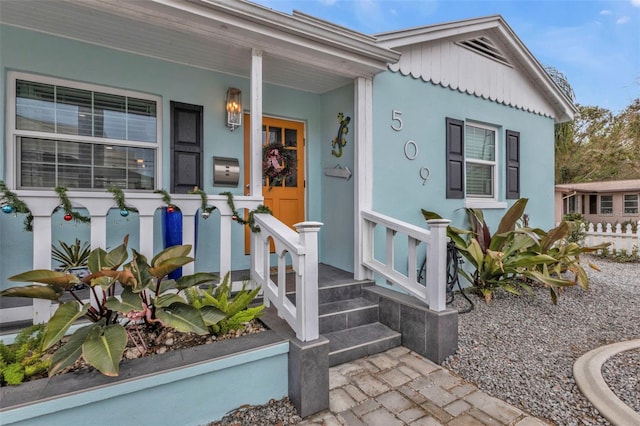 509 W Olympia Ave, Punta Gorda, FL 33950 - entrance to property with stucco siding and covered porch