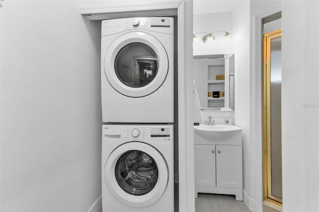 509 W Olympia Ave, Punta Gorda, FL 33950 - laundry room with stacked washer and clothes dryer and light tile patterned floors