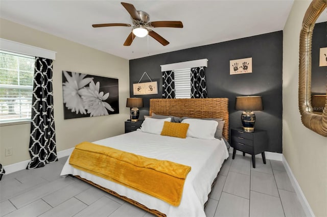 bedroom featuring tile patterned flooring and ceiling fan