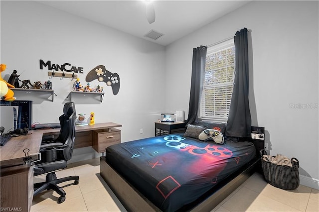 tiled bedroom featuring ceiling fan