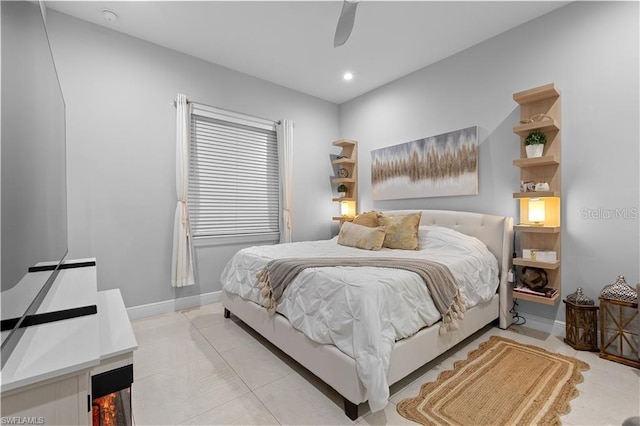 bedroom featuring ceiling fan and light tile patterned floors