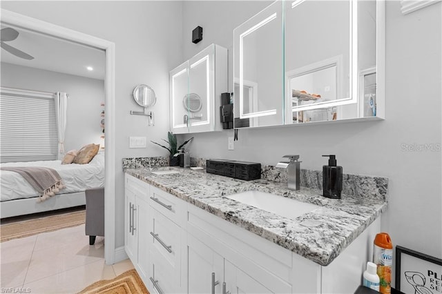 interior space featuring tile patterned flooring, vanity, and ceiling fan